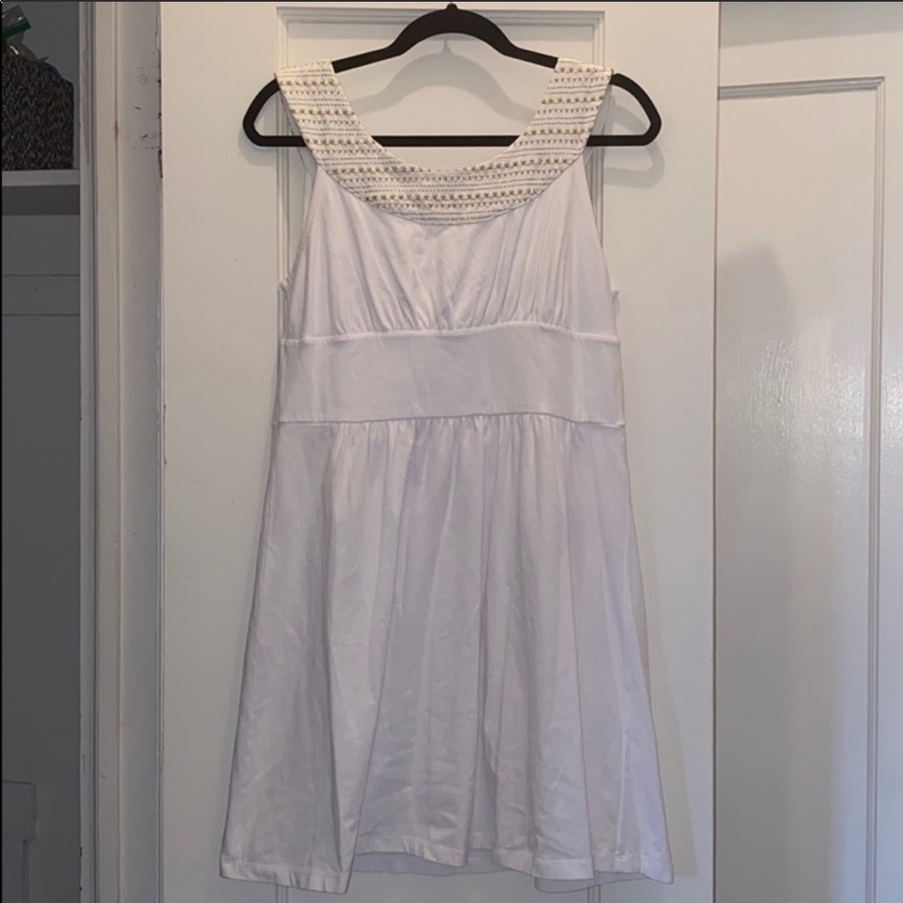 White dress with gold accent neckline